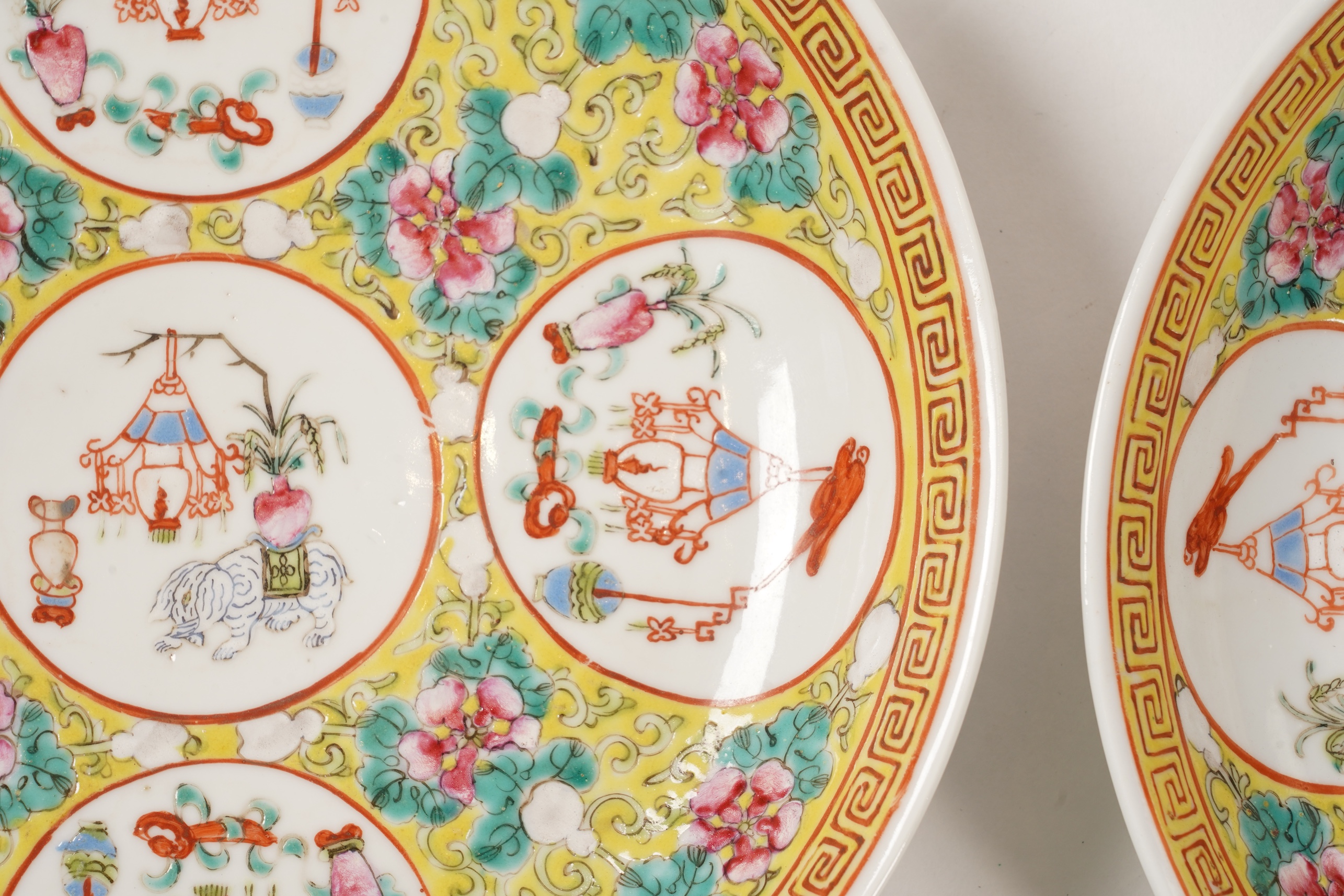 A pair of Chinese yellow ground medallion saucer dishes, Guangxu six character marks, early 20th century